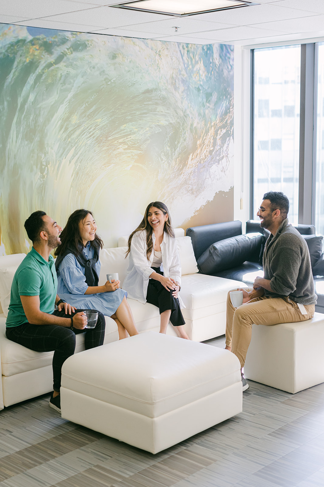Four employees chatting at the Groundswell office 